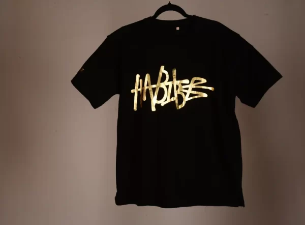 Habibe Essentials Black Gold Tshirts Plain Background